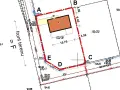 Plan działki z zaznaczonym budynkiem i wymiarami. Określona powierzchnia zabudowy na działce 115/19.